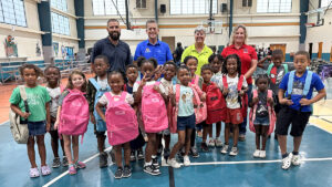 Indian River County Commissioners Susan Adams and Joe Flescher, WM, and GYAC campers and were all smiles with their new backpacks.
